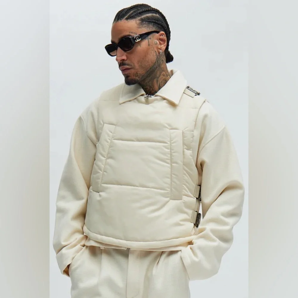 Roller Coaster Puffer Vest" in Off White from the brand Fashion Nova. - Picture 1 of 10